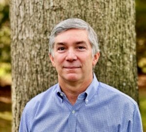 Headshot of Alec Crawford, an AI risk management expert and founder of AI Risk, Inc.