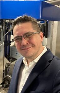 Headshot of Konrad Jeleń, Executive CTO at PMR and AI expert.