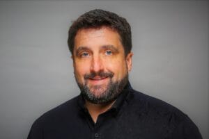 Professional headshot of Ryan Pollyniak, expert guest on the Innovation Tales podcast.